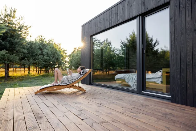 woman relaxing in terrace deckchair 